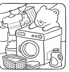 a teddy bear sitting on top of a washing machine next to clothes and other items