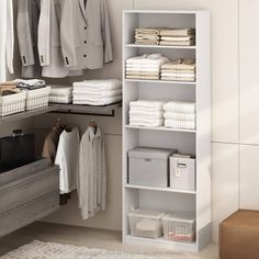 an organized closet with clothes and linens