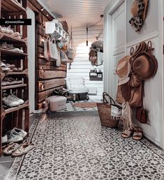 an entry way with baskets and shoes on the floor