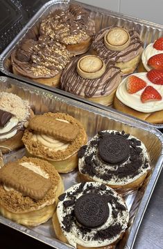 two trays filled with different types of pastries