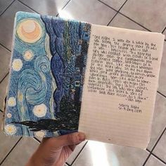 someone is holding up a notebook with an image of the starry night on it