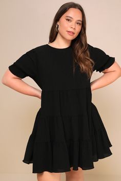 Make any day the best day ever with the Lulus Favorite Day Black Puff Sleeve Tiered Mini Dress! Lightweight crinkly woven fabric shapes this dress that has a crew neckline, puffy short sleeves with elastic ruffle cuffs, and a relaxed bodice. The swingy skirt is accented with rows of tiers before ending at a mini hem. Keyhole opening and button closure at back. Fit: This garment fits true to size. Length: Mid-thigh. Size medium measures 33.75" from shoulder to hem. Bust: Works best for A to C cup Black Dress Outfit Casual, Tiered Mini Dress, Black Dress Outfits, Dress With Short Sleeves, Cup Sizes, Comfortable Room, Womens Black Dress, The Best Day, All Black Outfit