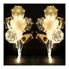 two vases with balloons and lights on them