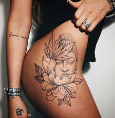 the back of a woman's thigh with tattoos on it