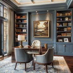 a home office with blue walls and built in bookshelves