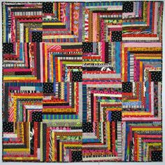 an abstract quilt made from strips of fabric