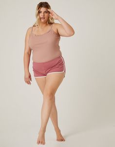 Be ready for anything with the Plus Size Hit The Ground Running Shorts. These super comfortable dolphin shorts have a contrast trim and elastic waistband. They're made from a smooth, stretchy knit material. These athletic shorts are made from 95% cotton and 5% spandex. Hand wash cold. Imported. Models are all wearing a size 1XL. Plus Size Looks, Dolphin Shorts, Curvy Plus Size, Contrast Trim, Knitting Materials, Running Shorts, Athletic Shorts, Black And Navy, Style Guides