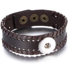 a brown leather bracelet with buttons on it