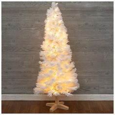 a white christmas tree with lights on it