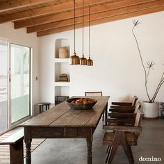 a wooden table sitting in the middle of a room