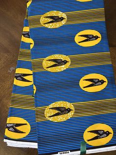 Our African wax print fabric is cotton. You can buy as much or as little as you want. This fabric is perfect for creating, clothing, head wraps, face masks, pillows, dolls, household decorations, quilts, bags, and more. Please contact us with any questions. Happy shopping! Ankara Fabric Bird, African Head Wraps, Yellow Bird, African Wax Print, Household Decor, Ankara Fabric, African Dresses, Wax Print, Lamp Shades