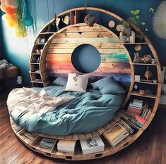 a circular bed made out of bookshelves in a room with blue walls and wooden floors