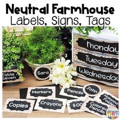 a table topped with potted plants next to black and white labels that read neutral farmhousee labels, signs, tags