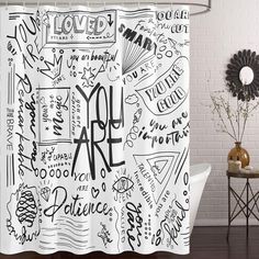 a shower curtain with some writing on it