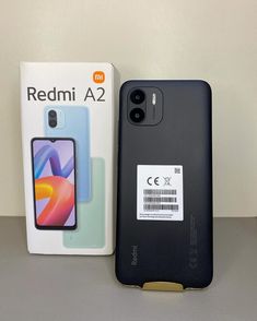 the new redmi a2 is in its box and next to it's packaging