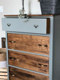 an old dresser has been painted blue and brown