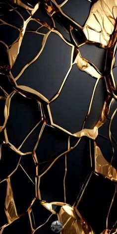 an abstract black and gold wallpaper with lots of metallic foil on it's surface