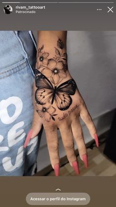 a woman's hand with a butterfly tattoo on the left hand and flowers on the right