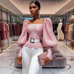 a mannequin wearing a pink top and white pleated skirt in a clothing store