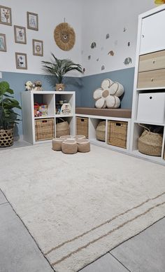 a white rug in a room with baskets and other items on the floor next to it