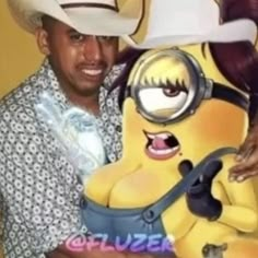 a man in a cowboy hat holding a stuffed toy with a minion on it