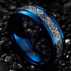 a blue ring with an intricate design on it