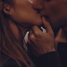 a man and woman kissing each other in front of a white background with the words love written on it