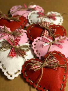 several heart shaped pillows tied together with twine