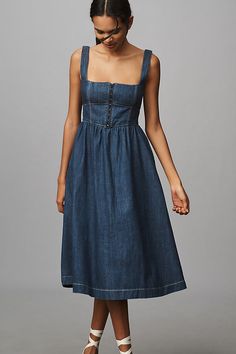 Denim, decoded: We’re digging denim in every corner of our closet. A different sort of Tagliatelle. Crafted from denim, the Tagliatelle Midi Dress by Reformation presents a fitted, corset-style bodice and full, swinging skirt. | Tagliatelle Denim Midi Dress by Reformation in Blue, Women's, Size: 12, Cotton at Anthropologie Bodycon Midi Fitted Dress, Formal Denim Dress, Womens Midi Dress, Denim A Line Dress, Long Denim Dress Outfit, Diy Denim Dress, Midi Skirt Outfit Spring, Denim Dress Outfit Summer, Long Denim Skirt Outfits