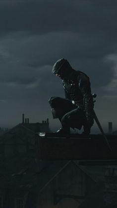 a man on top of a roof with two swords