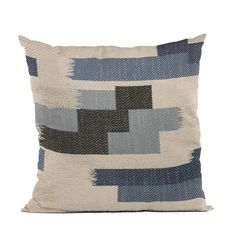 a blue and white pillow on a white background with an abstract design in the middle