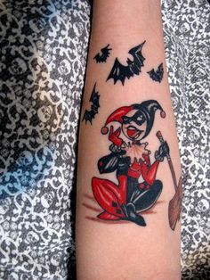 an image of a tattoo on someone's arm with bats in the sky behind her