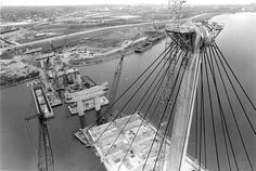 an aerial view of a bridge with construction in the background