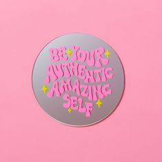 a round sticker with the words be your authentic amazing self written in pink on it