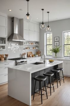 Modern kitchen with white cabinets, stainless steel appliances, and a large white island with black stools. Modern Kitchen Design White Cabinets, White Kitchen With Character, Grey And White House Interior, Gray And White Kitchen Ideas Inspiration, Add Color To White Kitchen, Kitchen Design White Cabinets, Timeless White Kitchen, White Kitchen Cabinets Ideas