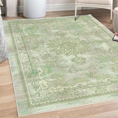 a green rug with an ornate design on it