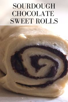 a close up of a pastry on a table with the words sourdough chocolate sweet rolls