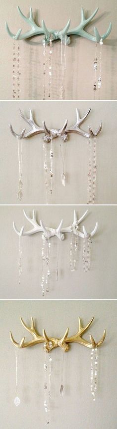 four different types of deer antlers hanging on the wall, each with crystal beads