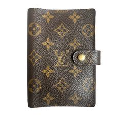 a brown and yellow louis vuitton wallet with gold lettering on the front pocket