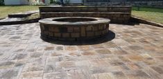 a fire pit sitting on top of a brick patio