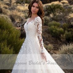 a woman in a wedding dress posing for the camera