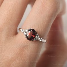 * The delicate ring displays Garnet as main stone. The cluster side stones make the ring similar to the blooming flower . For who wearing this special & delicate ring, will shine like a goddess. ◆ Production Description: Main stone Type: Garnet Main Stone Shape: Oval Cut Main Stone Size: 6*8mm(1.73ct) Side stone: CZ Metal: 925 Sterling silver - Other options available in the drop down menu ◆ Customization: √Free for Add Engraving √Other Metal Type Available √Other Gemstones & Shapes Avai Delicate Oval Crystal Promise Ring, Garnet Ring With Prong Setting, Elegant Garnet Cluster Ring With Birthstone, Elegant Garnet Birthstone Cluster Ring, Delicate Oval Gemstone Birthstone Ring, Delicate Oval Birthstone Ring, Elegant Gemstone Flower Ring For Promise, Elegant Topaz Gemstone Ring For Proposal, Elegant Garnet Cluster Ring For Wedding