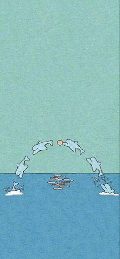 two people are swimming in the ocean with an orange ball above their head and one person is jumping into the water