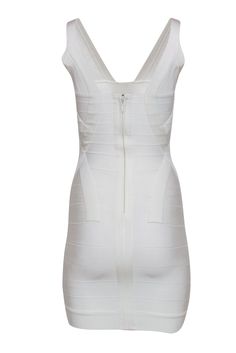 Go white hot for the club with this radiant frock from Herve Leger! Made in the brand's famous curve-hugging bandage style with a radiant white hue, this sultry stunner is sure to shine on your next night out. All eyes will be on you as soon as you step on the dance floor when you pair this beauty with strappy stilettos and a bold red lip -- you're sure to score a few digits and drinks! Size XS 90% Rayon, 9% Nylon, 1% Spandex Concealed back zipper Unlined Bodycon silhouette V-neckline Sleeveless White Bandage Dress For Summer, White Sleeveless Bandage Dress For Night Out, White Bandage Bodycon Dress For Night Out, Elegant White Bandage Dress For Club, White Bodycon Bandage Dress For Night Out, White Fitted Bandage Dress, White Summer Bandage Dress For Club, White Bandage Dress For Club, White Stretch Bandage Bodycon Dress