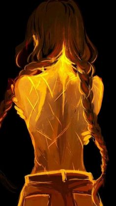 the back of a woman's body in yellow light