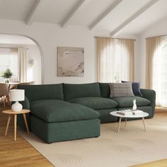 a living room with a large green couch