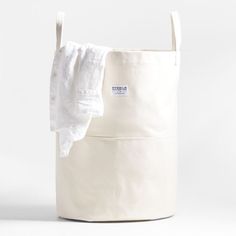 a large white bag with a cloth hanging from it's side and the bottom half open