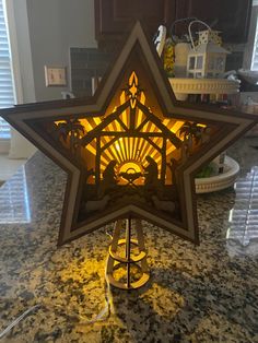 a star shaped lamp sitting on top of a counter