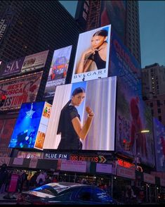 a large billboard on the side of a building in times square, new york city