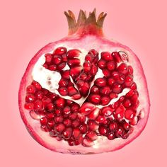 the pomegranate is cut in half and ready to be used as a garnish